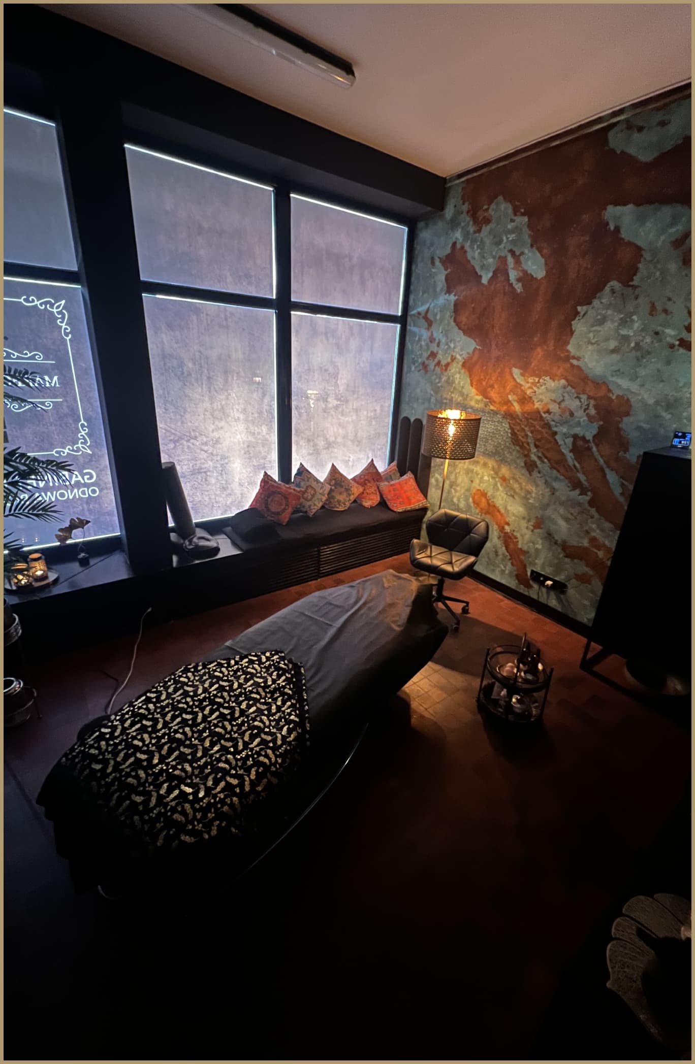 Copper bowls with spa treatments on a tray with decorative lighting